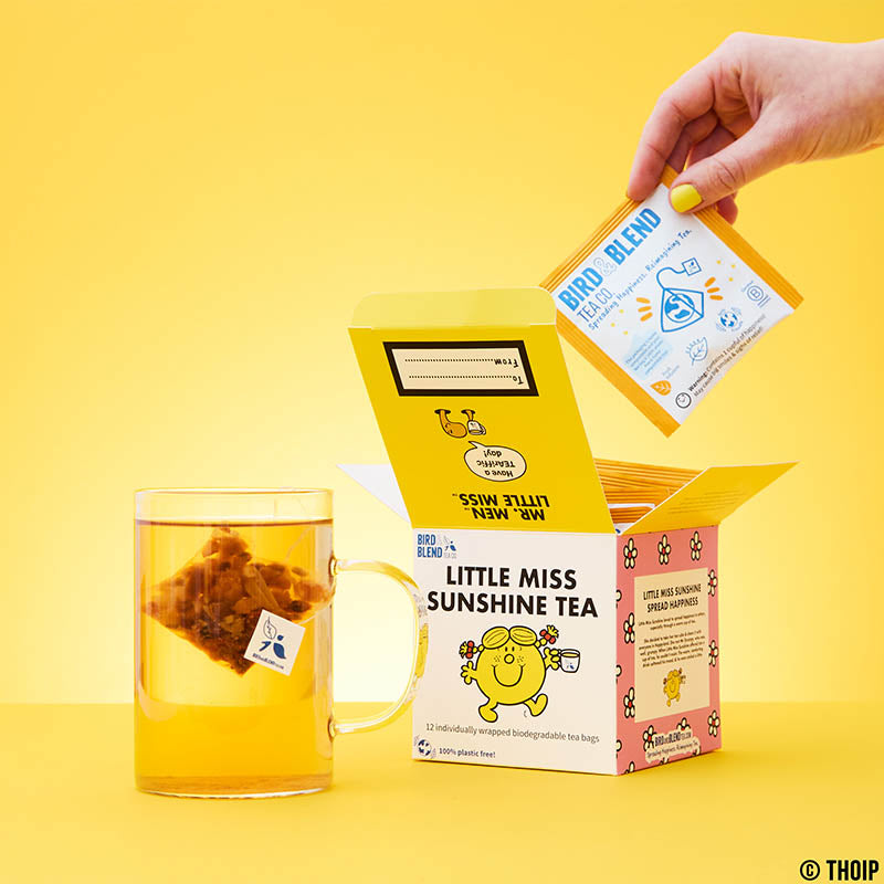 little miss sunshine tea cube open taking tea bag out