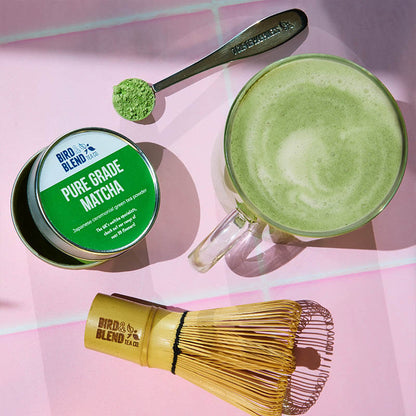 matcha tin with tea spoon and whisk